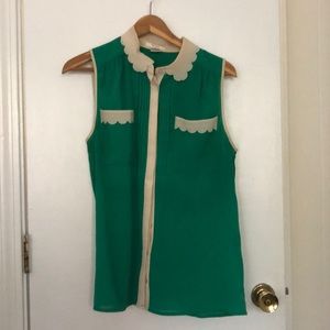 Green sleeveless tank with cream ruffles
